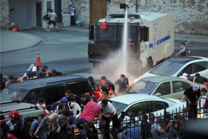 Police use a water cannon to disperse protestors outside Turkish Prime Minister Recep Tayyip Erdogan's working office in Besiktas Istanbul, on June 2, 2013, during a third day of clashes sparked by anger at his Islamist-rooted government. White fumes filled the air as riot cops fired gas and lashed stone-throwing protestors with water-cannons in the two cities, the latest in a string of nationwide clashes that have left scores injured. AFP PHOTO /OZAN KOSE (Photo credit should read OZAN KOSE/AFP/Getty Images)