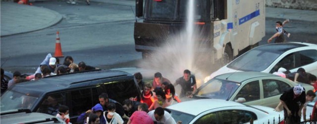 Police use a water cannon to disperse protestors outside Turkish Prime Minister Recep Tayyip Erdogan's working office in Besiktas Istanbul, on June 2, 2013, during a third day of clashes sparked by anger at his Islamist-rooted government.  White fumes filled the air as riot cops fired gas and lashed stone-throwing protestors with water-cannons in the two cities, the latest in a string of nationwide clashes that have left scores injured. AFP PHOTO /OZAN KOSE        (Photo credit should read OZAN KOSE/AFP/Getty Images)